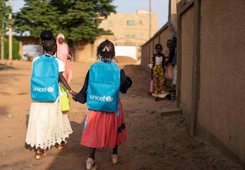 Sisters Soraya, 10, left, and Assiatou, 6, heading to school in Niger.