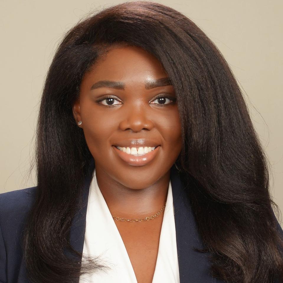 Headshot of Tracey Akanbi smiling.