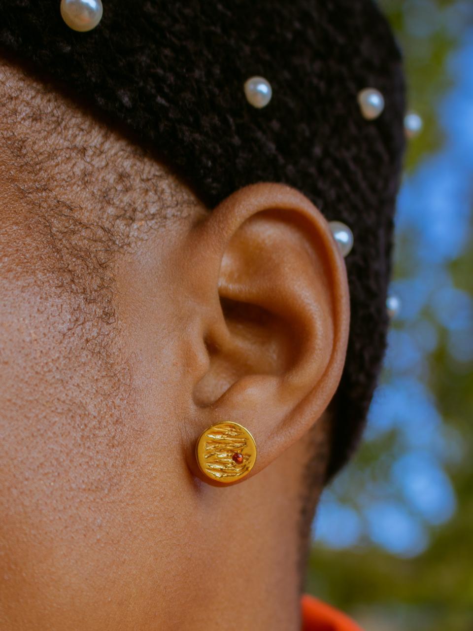 The Jupiter earrings by Kassandra Lauren Gordon, 18kt gold vermeil with red sapphires.