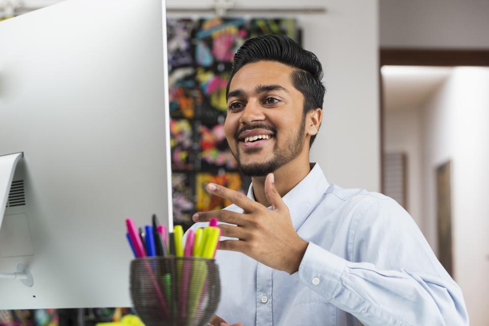 Middle Eastern businessman giving a virtual presentation