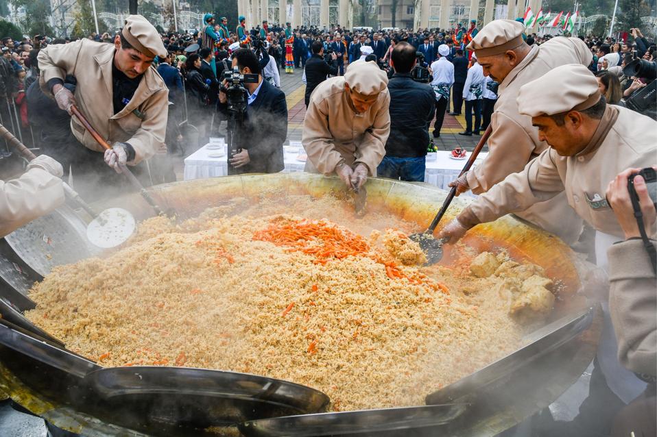 Cooks preparing pilau for Oshi Palav, in Dushanbe, Tajikistan