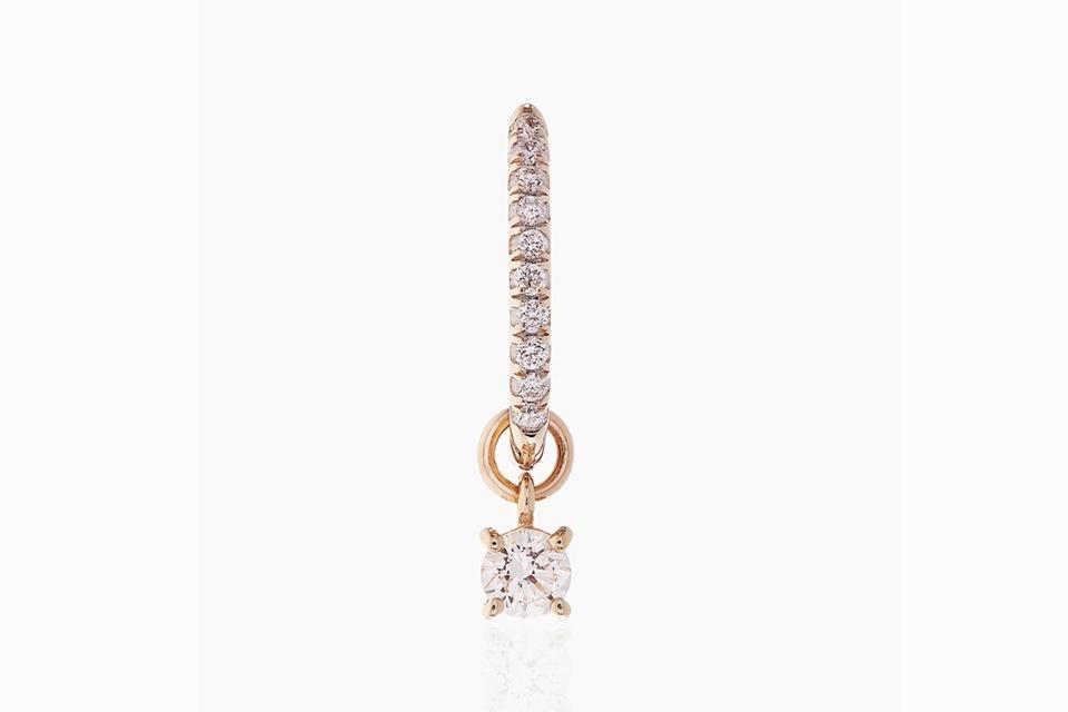 Otiumberg Diamond Charm Hoop earring in 9K yellow gold with .15 carats diamond, $730, otiumberg.com