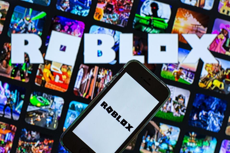 In this photo illustration, the Roblox app seen displayed on...