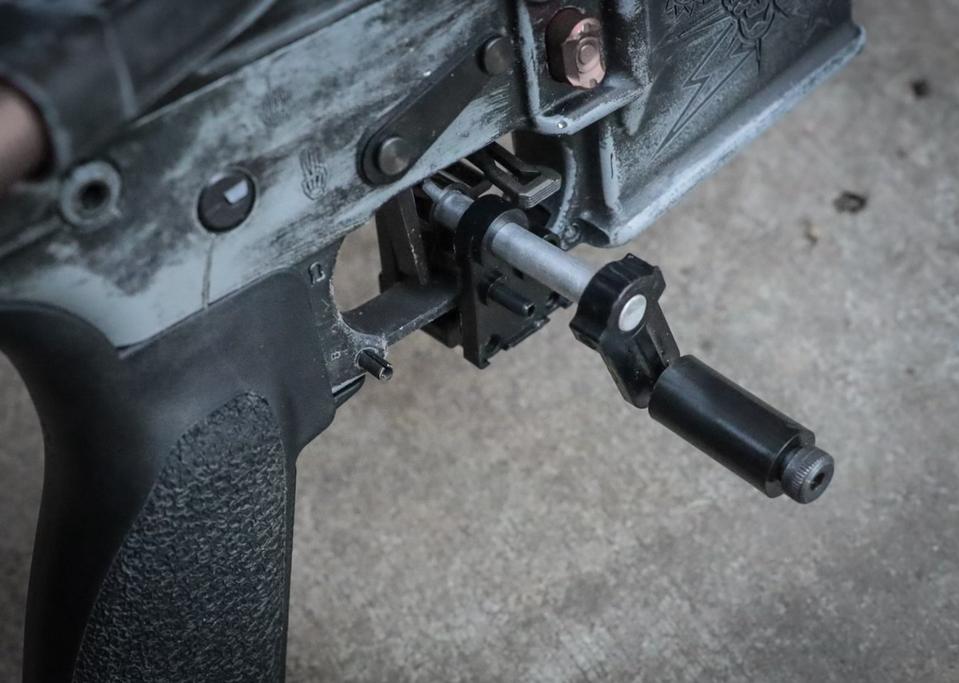 Gat cranks, also known as hand cranks, are attached to the trigger guards of semiautomatic rifles including AR-15s to speed up the rate of fire, mimicking full auto.