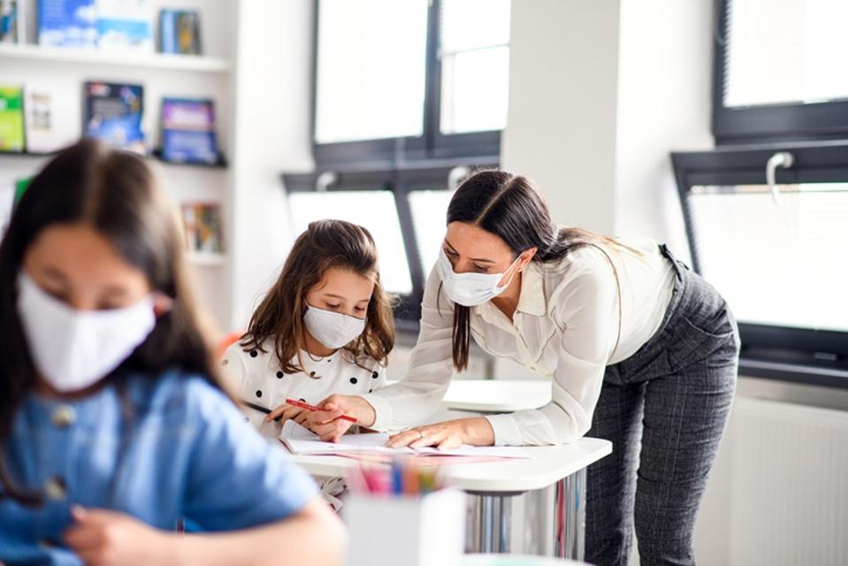 Teacher with students.