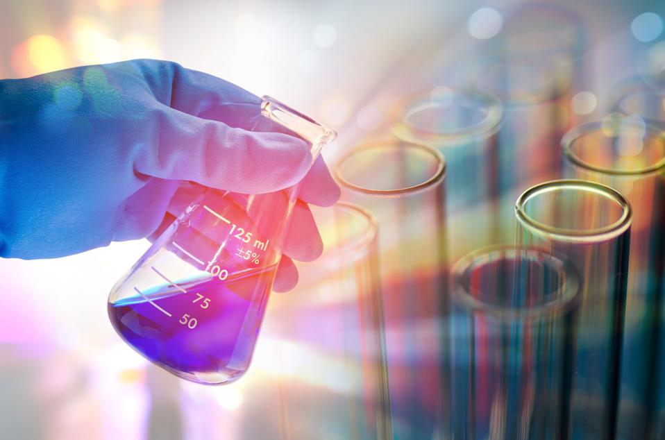 Cropped Hand Of Scientist Testing Chemicals In Laboratory