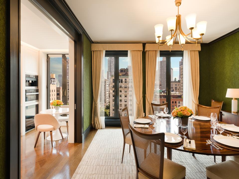 A duplex residence at Fasano Fifth Avenue, featuring custom green textured wallpaper.