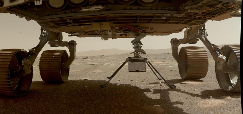 NASA's Ingenuity helicopter can be seen here with all four of its legs deployed before dropping from the belly of the Perseverance rover on March 30, 2021, the 39th Martian day, or sol, of the mission.