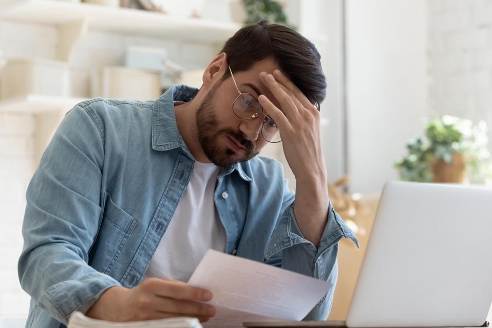 This 40%-Discounted Fund Is A Great Way To Lose Money 4 Upset frustrated young man holding reading postal mail letter