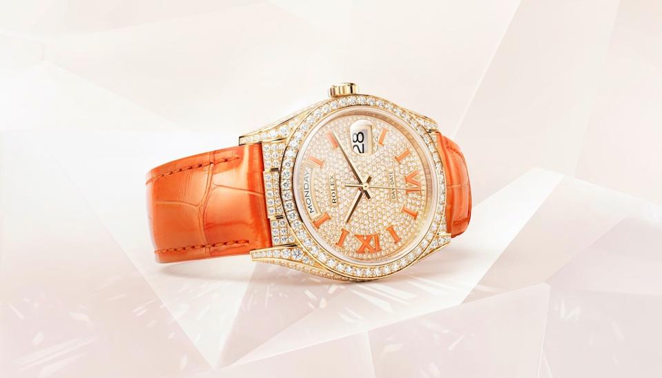 The coral enamel markers match the coral strap