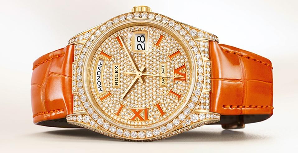 Diamond paved Rolex Day-Date 36 with coral enameled numerals and a coral alligator strap.