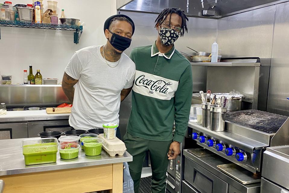 Chef-owners Solomon Johnson (green shirt) and Michael Woods of The Bussdown in Oakland, CA
