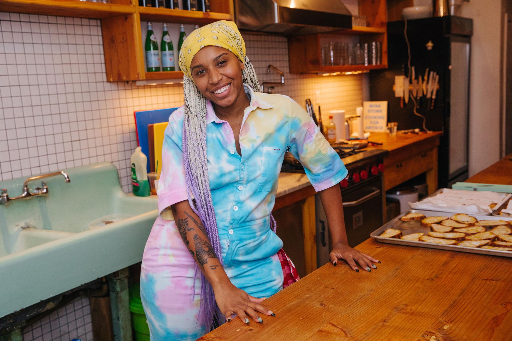 From Executive Chef To Entrepreneur: Why Kia Damon Is Dedicating Her Life To Feeding LGBTQ+ And Black Communities 3 Kia Damon in a kitchen