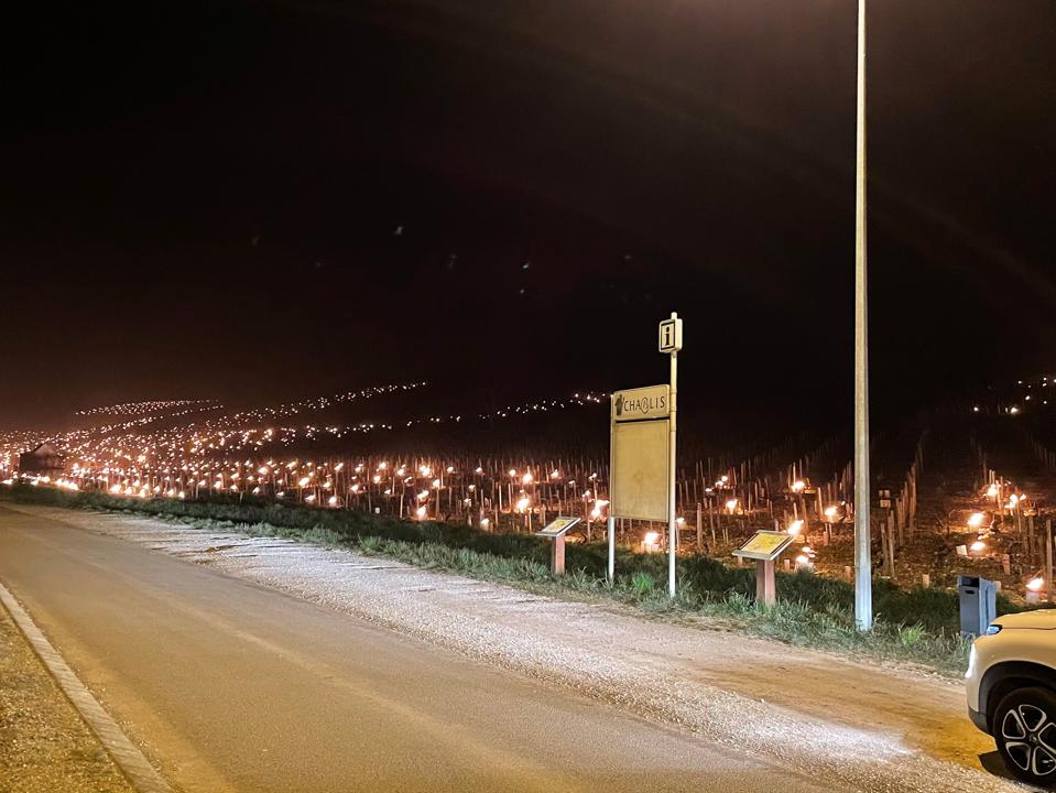 ‘Too Early To Have A Precise View’: French Winemakers Deal With Harsh Spring Frost 6 Chablis sign with vineyard filled with candles