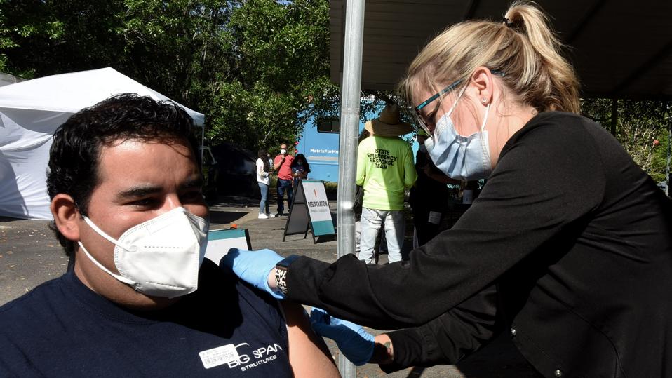 Experts Say Pausing J&J Shot Should Increase Vaccine Confidence—But Polling Shows It Likely Won’t 2 A nurse gives Edgar Garcia a shot of the Johnson & Johnson...