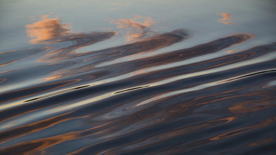 Cloud reflection in wake of river cruise ship Excellence Katharina of Reisebuero Mittelthurgau (formerly MS General Lavrinenkov) at sunset, Volga river, Russia