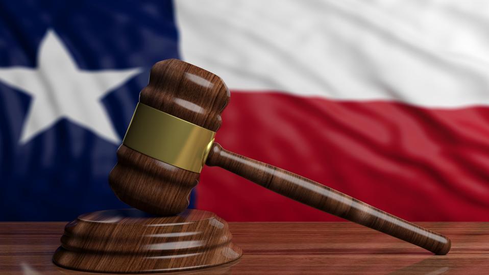 Judge or auction gavel on Texas US America flag background. 3d illustration