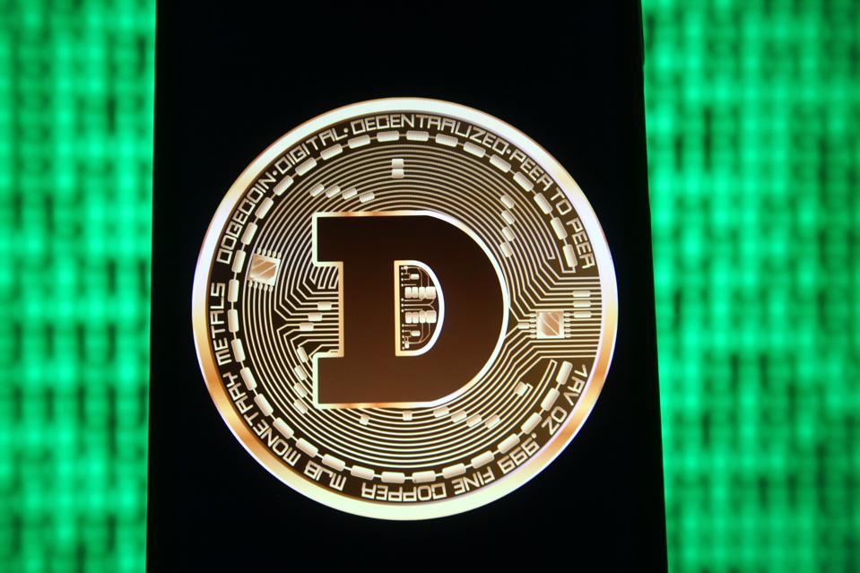 In this photo illustration a Dogecoin sign of a digital...