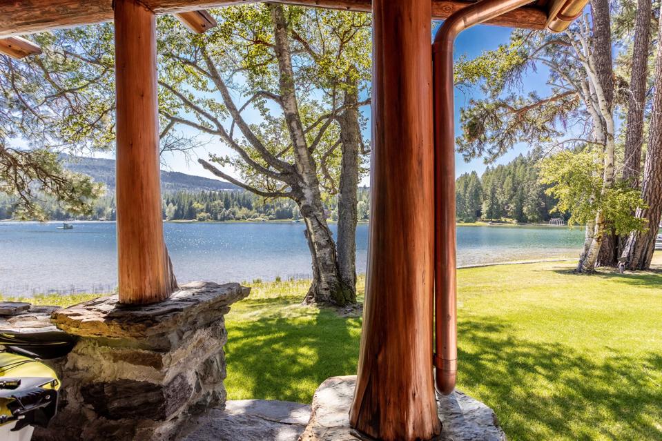 porch swan lake log home cornelius kelley copper baron bigfork montana