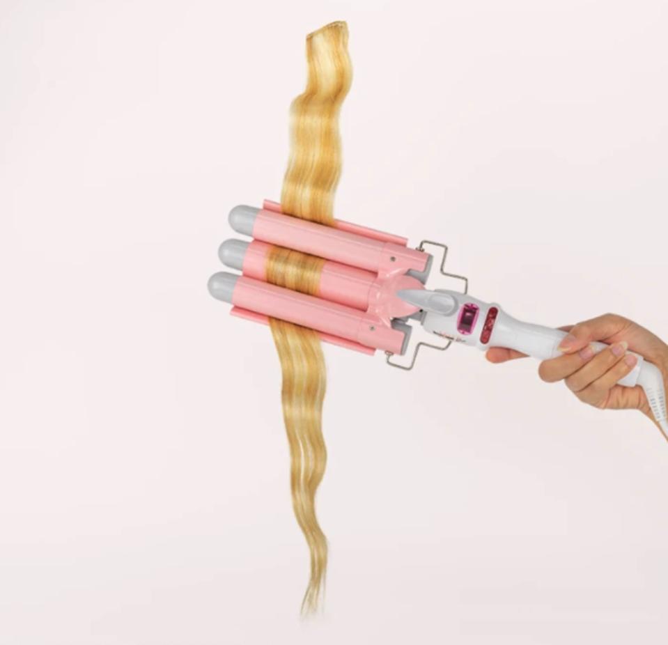 a multi tong hair styling tool in pink