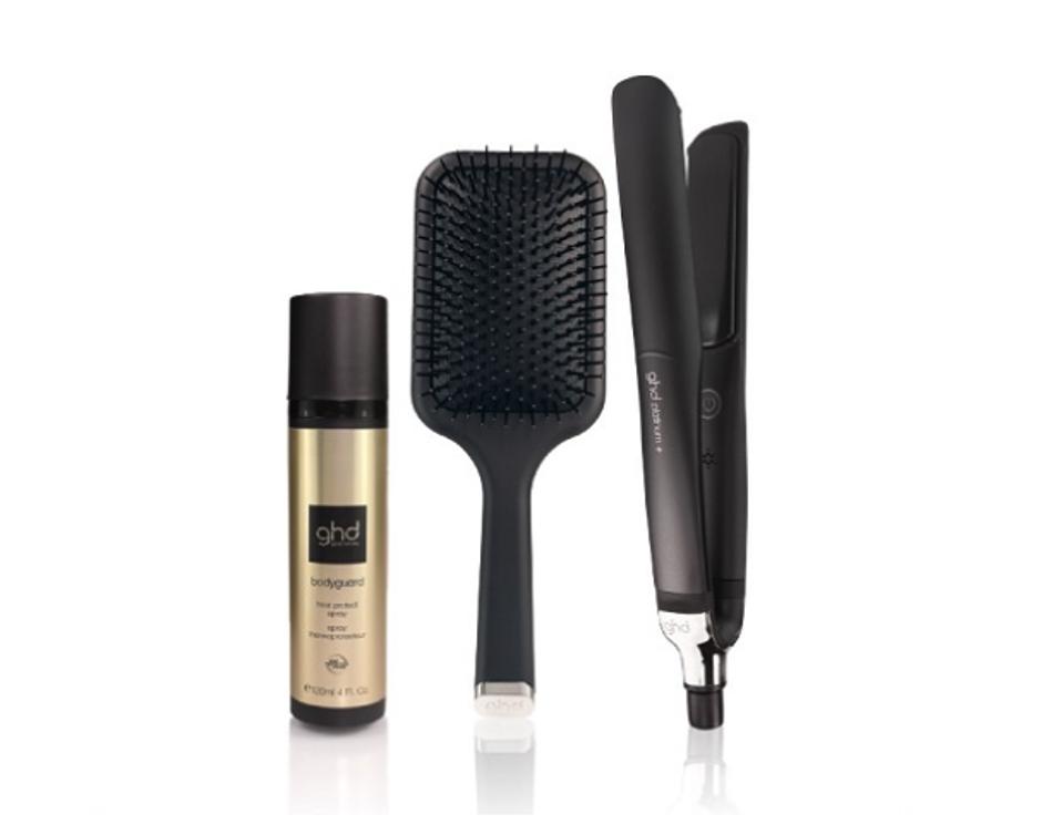 a hairspray, hair brush and a hair flatiron