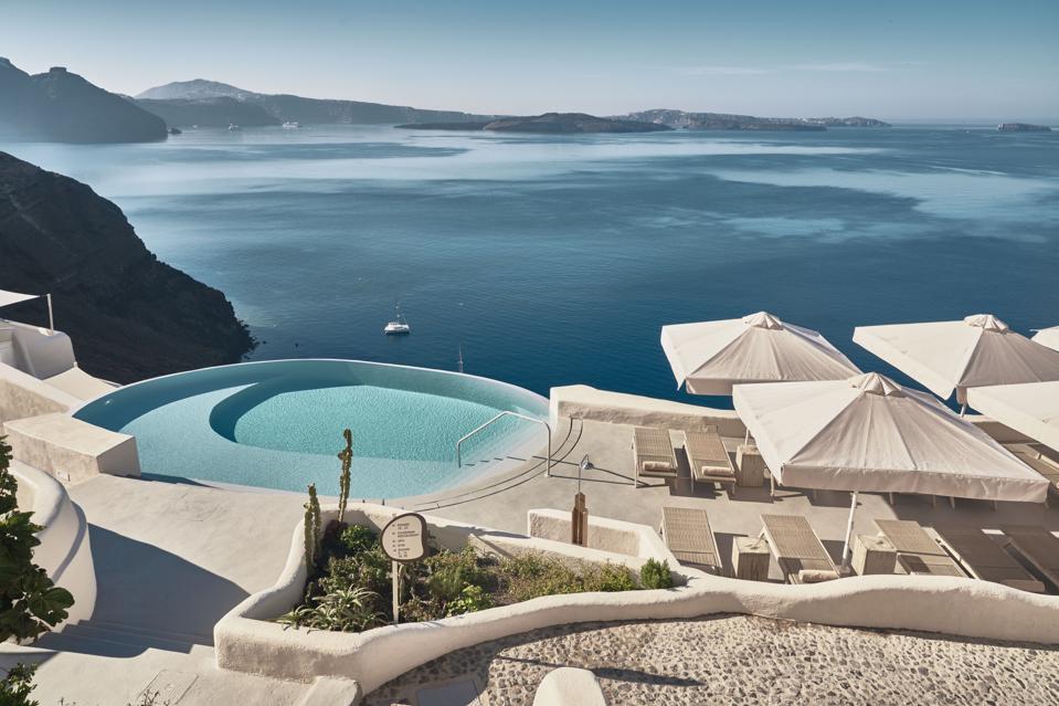 The pool at Mystique resort on Santorini, Greece, is above the Aegean Sea.