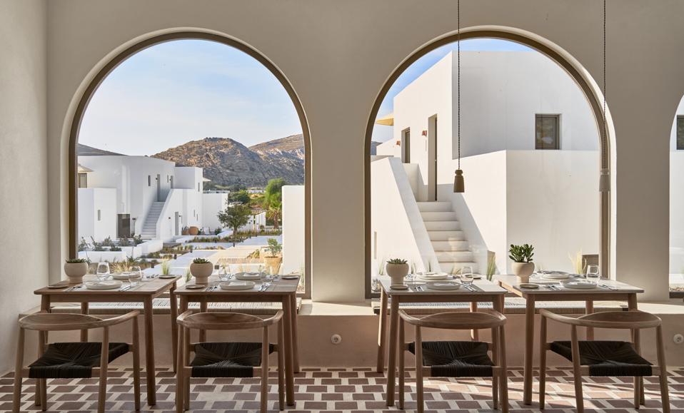 The dining room at Parilio hotel on Paros, Greece, has big arched windows
