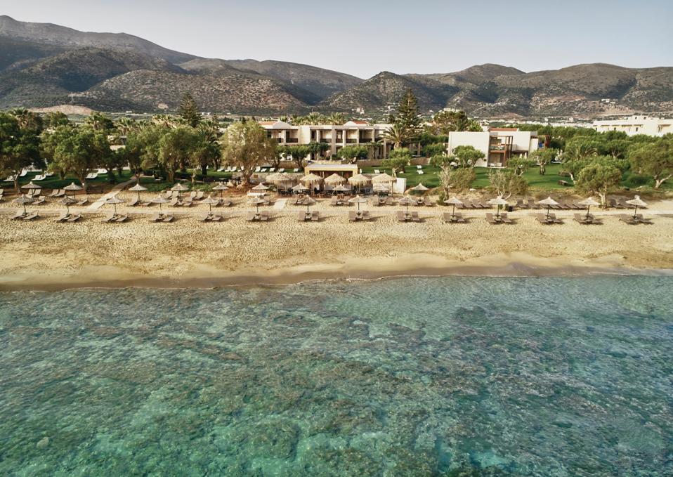 There is clear water beyond the beach at Cretan Malie Resort on Crete, Greece