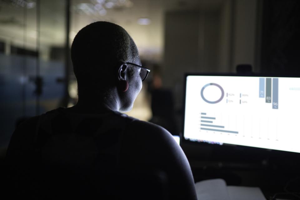 The Fuel Powering America’s Public Sector Rear view of businesswoman working late in the office