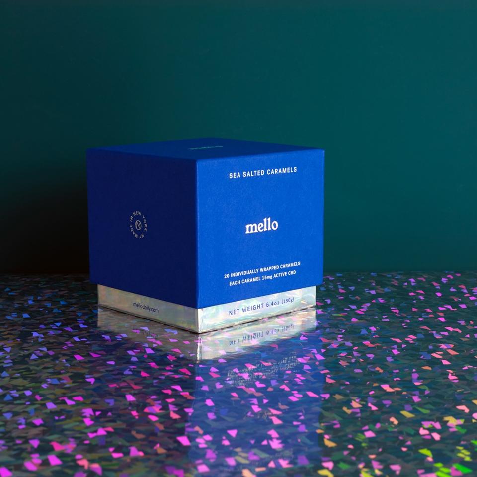 A box of Mello CBD Sea Salted Caramels surrounded by confetti.