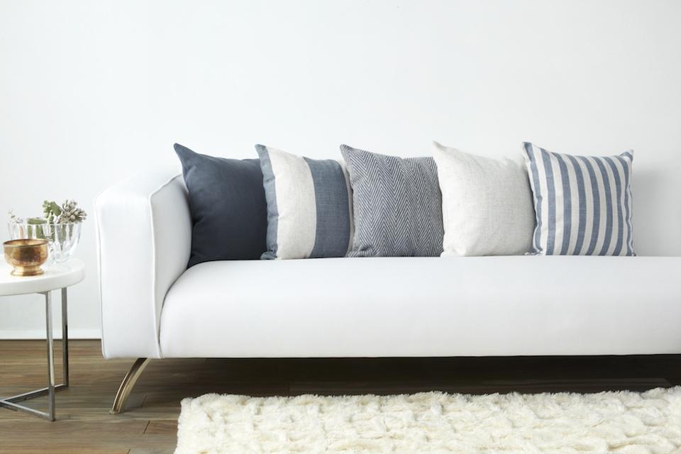 Pillow Pops Sail Away Collection -various blue pillows on a white sofa in a living room