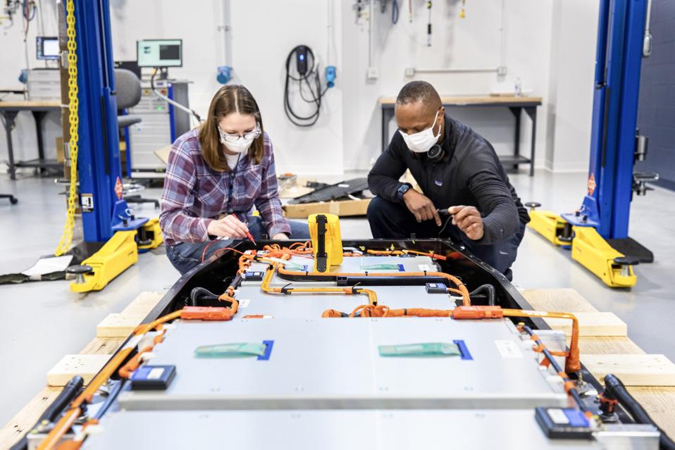 Ford Plans “Ion Park” In Michigan To Develop Electric Vehicles Batteries Dane Hardware, Ford Motor Co. design and release engineer, and Mary Fredrick, Ford Motor Co. battery validation engineer, measure the voltage of a battery using a digital multi-meter at Ford’s Battery Benchmarking and Test Laboratory in Allen Park, Michigan. Since this battery is not connected to a test setup, the meter is used to confirm the battery voltage and check isolation.