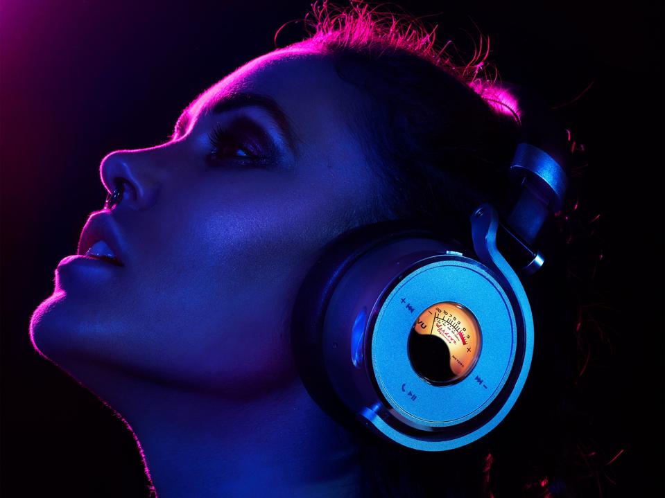 Woman wearing Meters OV-1-B-Connect headphones