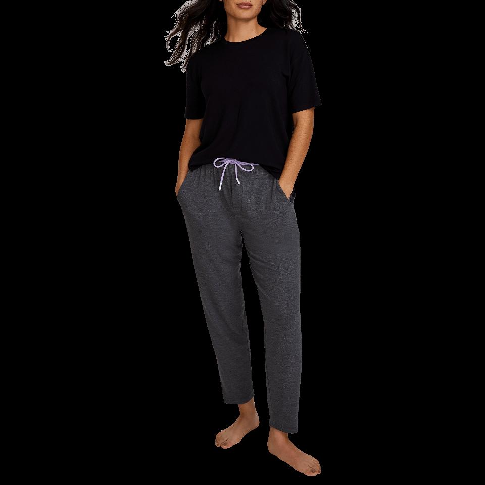 A woman wears a pair of grey Long Jambys.