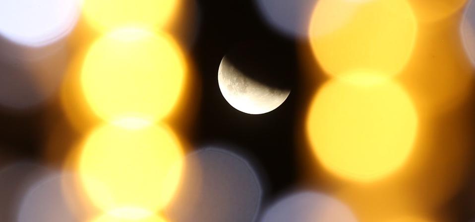 The shape of the edge of Earth’s shadow was used to estimate the ratio between the Moon and the Earth radii. Here's the Partial Lunar Eclipse is seen in Sakarya, Turkey on July 17, 2019. (Photo by Ibrahim Yozoglu/Anadolu Agency/Getty Images)
