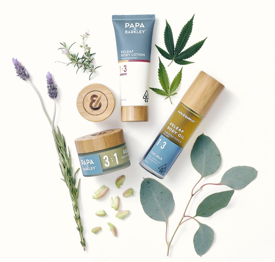 Papa & Barkley's THC skincare suite arranged with botanicals.
