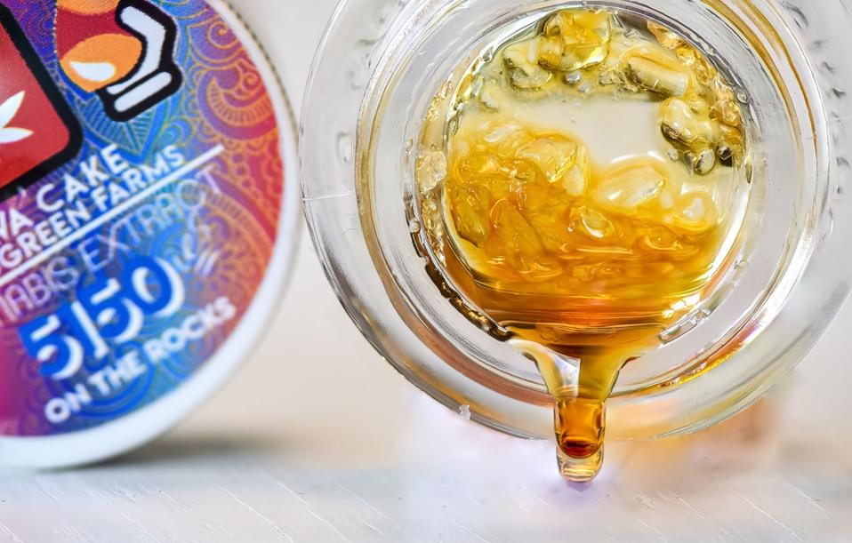 Extractioneering's Lava Cake cannabis extract dripping from its container.