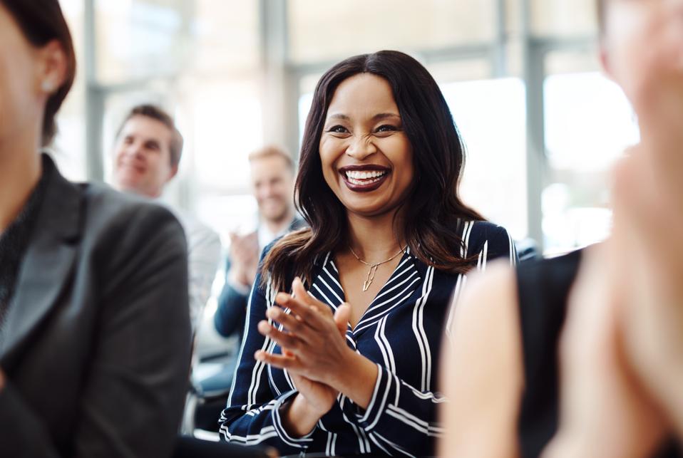 Business woman happy to hear that she received a promotion