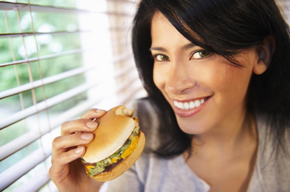 Woman eating a burger