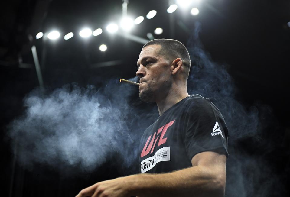 UFC fighter and cannabis activist Nate Diaz puffs a CBD joint during an open workout for fans and media at Honda Center on August 14, 2019 in Anaheim, California.
