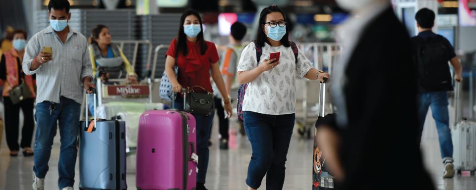 Air Travelers Wear Masks as a Precaution against Covid-19
