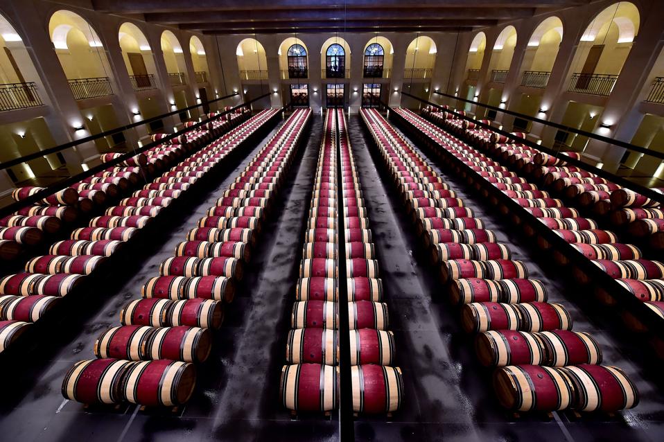 Château Montrose cellar room with barrels