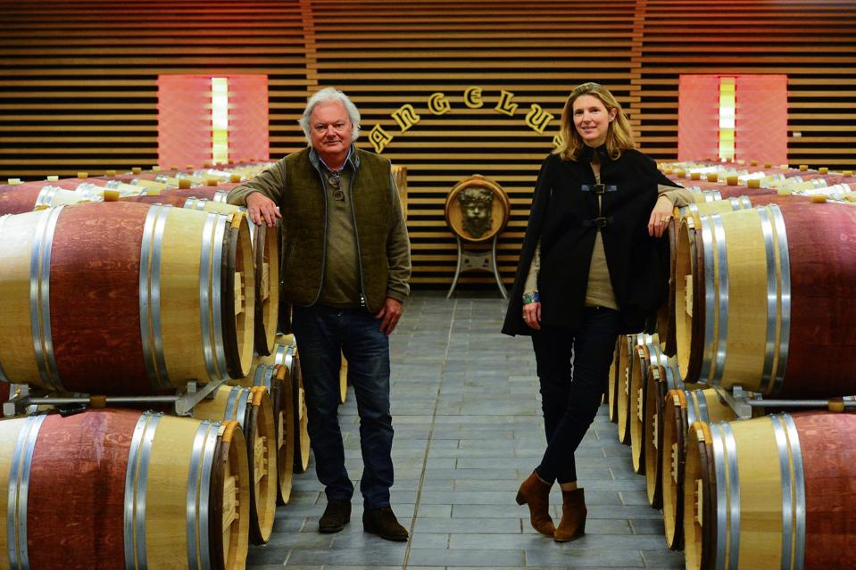 Owners of Château Angelus in cellar