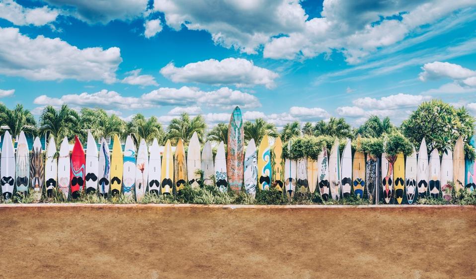 Old surfboards lined up as a fence in Hippie Town. Paia, Maui, Hawaii.