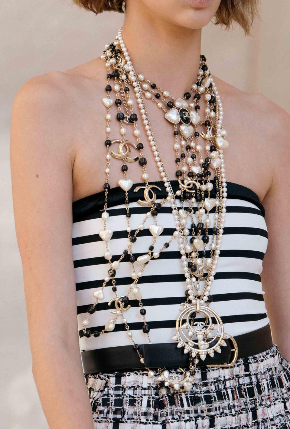 Layers of black and white, layers of chains, long necklaces