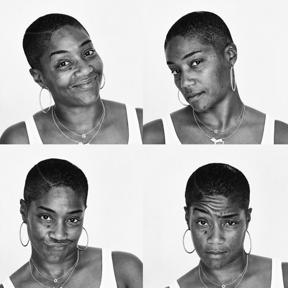 Four black and white portraits of Tiffany Haddish. She is in a white tank top, wearing a pair of large hoop, and two necklaces, one with the Star of David and the silhouette of a unicorn. Haddish looks at the camera in each portrait, one in which she's smiling, in the second portrait she tilts her head to the side, the third she is scrunching up her nose, and in the final portrait she raises an eye brow.