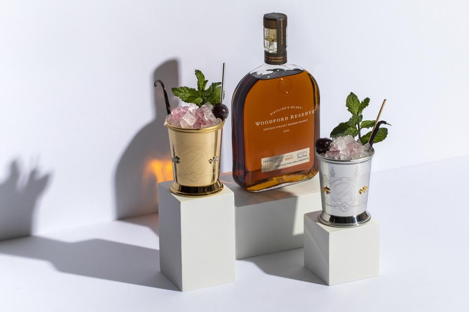 Woodford Reserve sits between two beautiful cocktails.