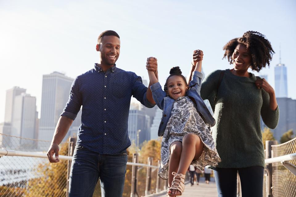 Young family taking a walk on footbridge, close up
