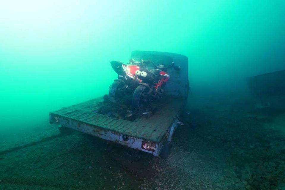 Sunken motorcyles and truck in Lake Como