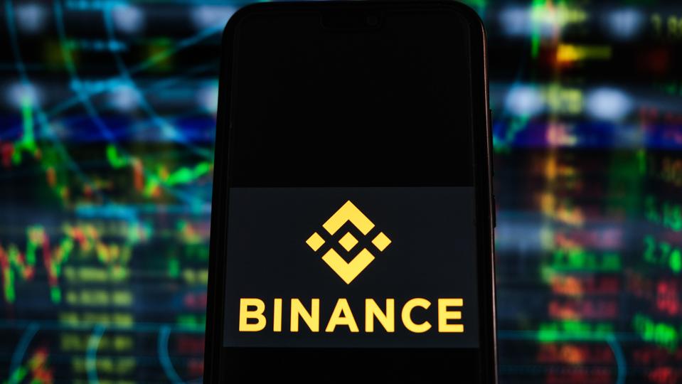 In this photo illustration a Binance logo seen displayed on...
